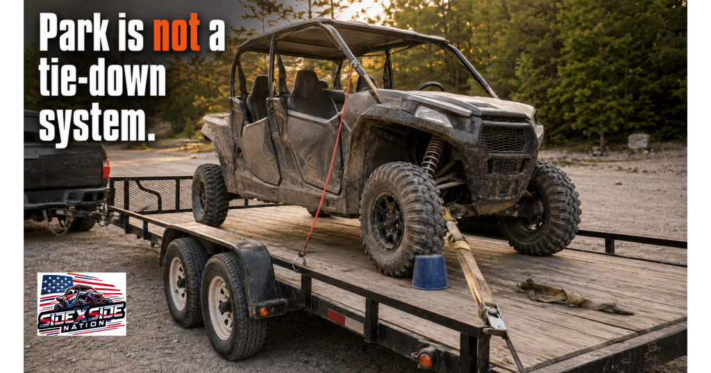 Poorly secured four-seat SXS on a trailer with a bungee, one ratchet strap and a bucket chock. Text reads, “Park is not a tie-down system.”