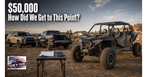 Four-seat performance UTV displayed beside a used SUV and pickup at a dirt trailhead, with financing paperwork and the headline “$50,000—How Did We Get to This Point?”